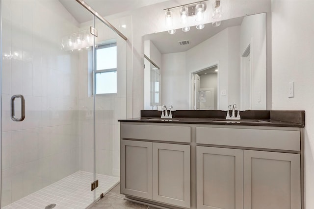 bathroom with vanity and walk in shower