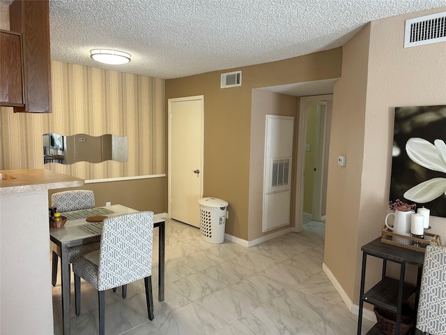 kitchen with a textured ceiling