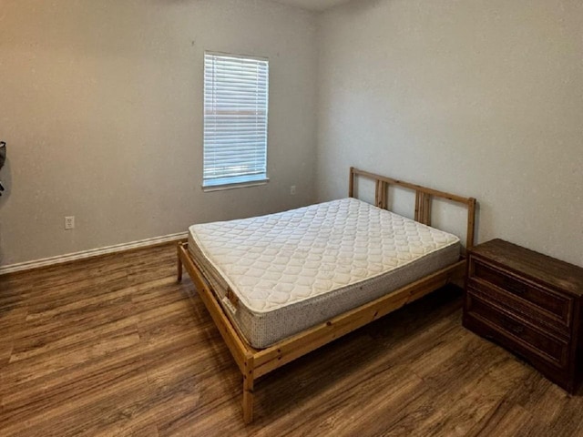 bedroom featuring dark wood-type flooring