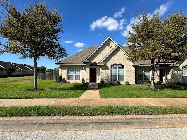 view of front of home with a front lawn