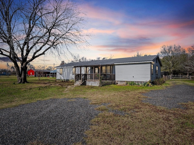 manufactured / mobile home featuring a yard