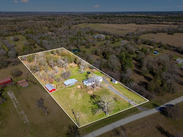 birds eye view of property with a rural view