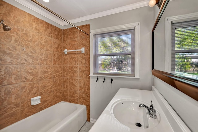 bathroom featuring plenty of natural light, vanity, crown molding, and tiled shower / bath combo