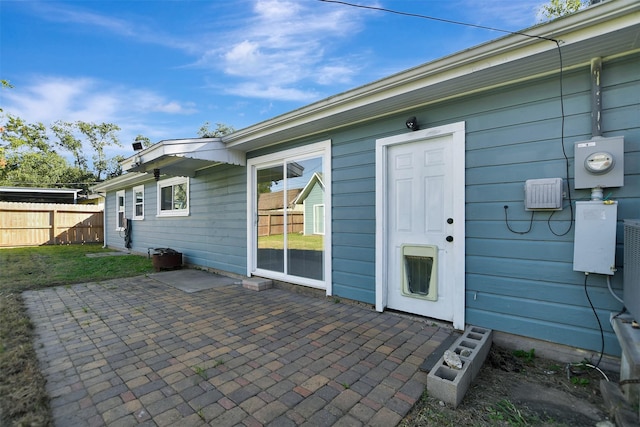 property entrance featuring a patio