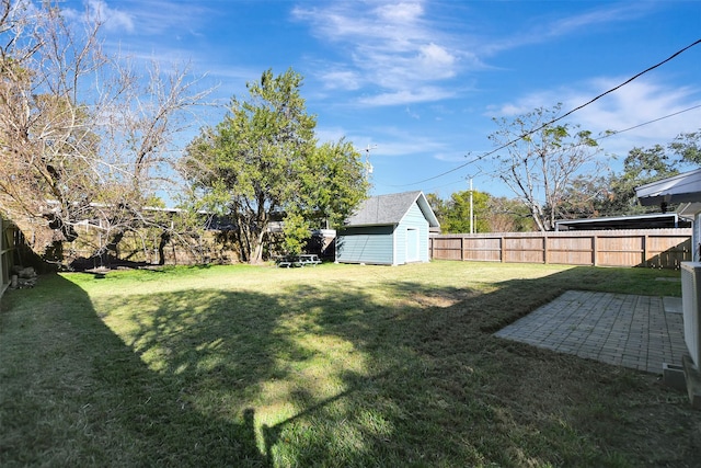 view of yard featuring a patio and a shed