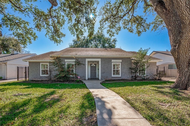 ranch-style home with a front yard