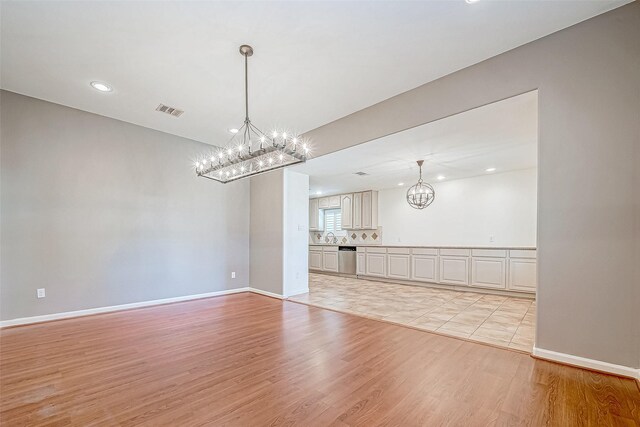 interior space with light hardwood / wood-style flooring and sink