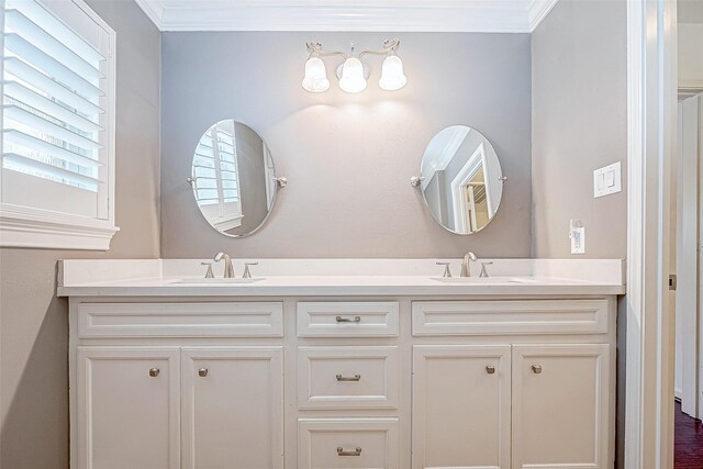 bathroom with vanity and crown molding