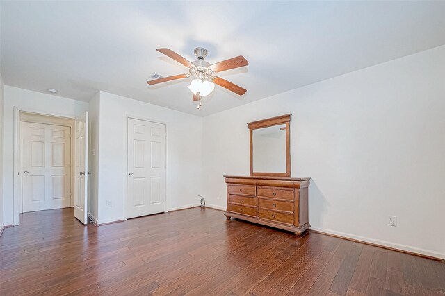 bedroom featuring ceiling fan and dark hardwood / wood-style flooring