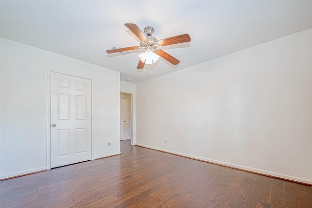 unfurnished bedroom featuring hardwood / wood-style floors and ceiling fan