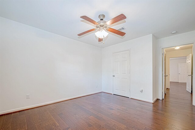 unfurnished room with ceiling fan and hardwood / wood-style floors