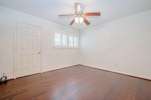 empty room featuring hardwood / wood-style floors and ceiling fan