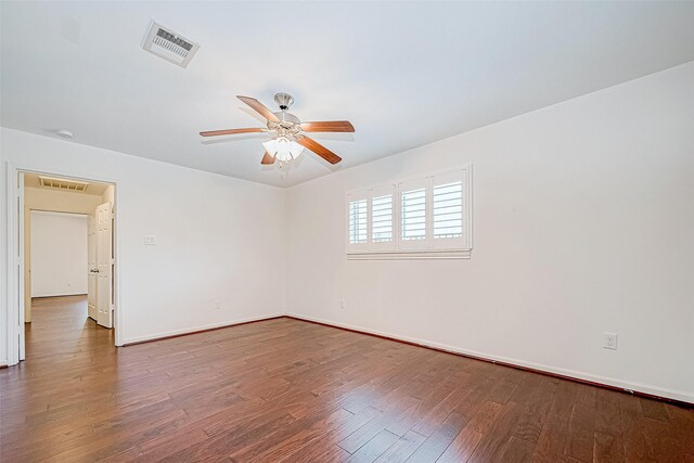 unfurnished room with hardwood / wood-style flooring and ceiling fan