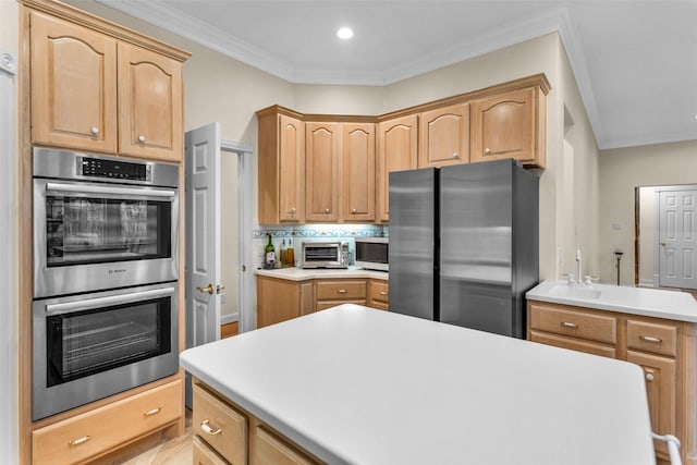 kitchen with appliances with stainless steel finishes, light brown cabinets, ornamental molding, and sink