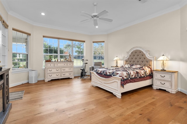 bedroom with ceiling fan, light hardwood / wood-style floors, and ornamental molding