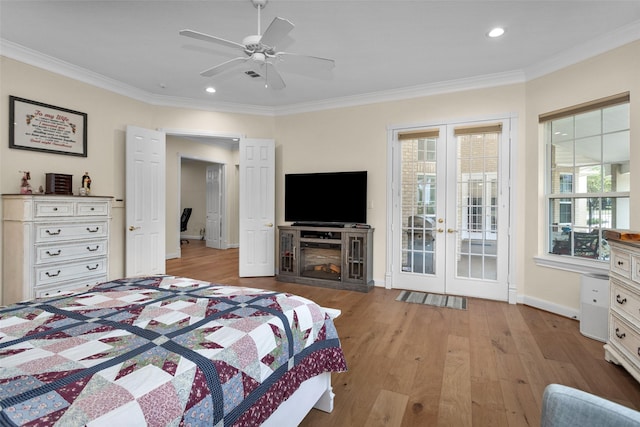 bedroom featuring ceiling fan, light hardwood / wood-style floors, ornamental molding, and access to outside