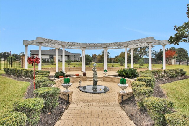 exterior space featuring a pergola, a yard, and a patio