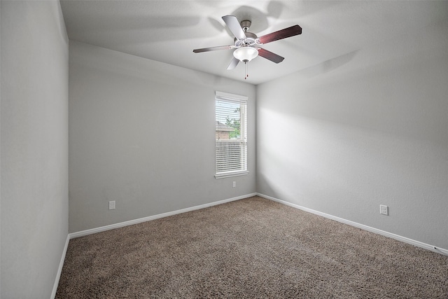 spare room featuring carpet floors and ceiling fan