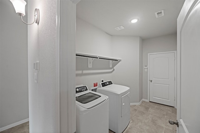 laundry area featuring washing machine and dryer