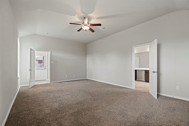 empty room with ceiling fan, lofted ceiling, and carpet floors