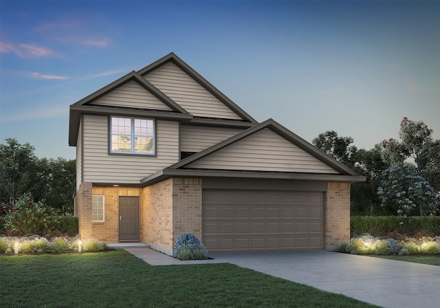 front of property with a lawn and a garage