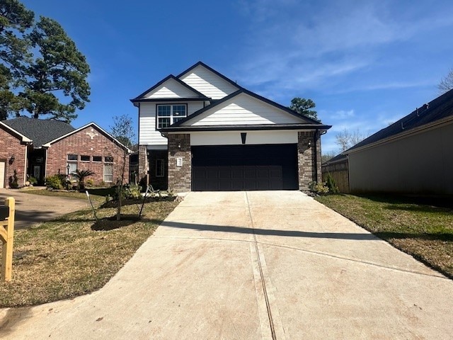 view of front facade with a front yard and a garage