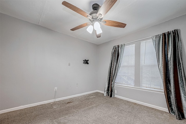 carpeted empty room with ceiling fan