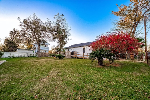 view of yard featuring a wooden deck