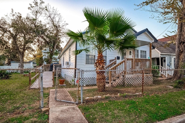 rear view of property with a lawn