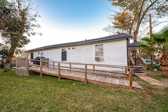 back of property featuring a yard, cooling unit, and a deck