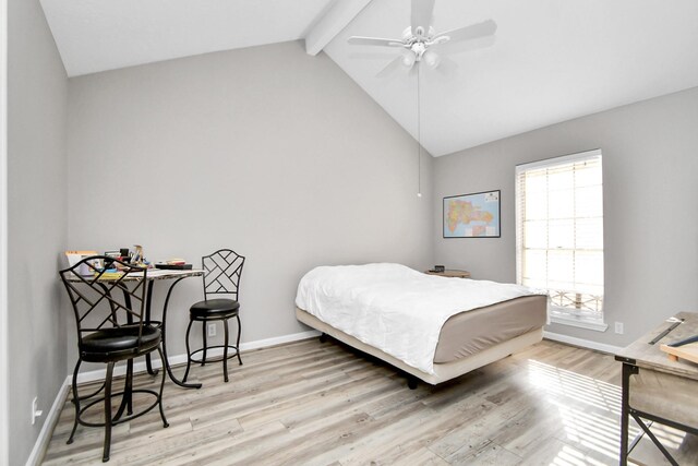 bedroom featuring vaulted ceiling with beams, ceiling fan, and light hardwood / wood-style flooring