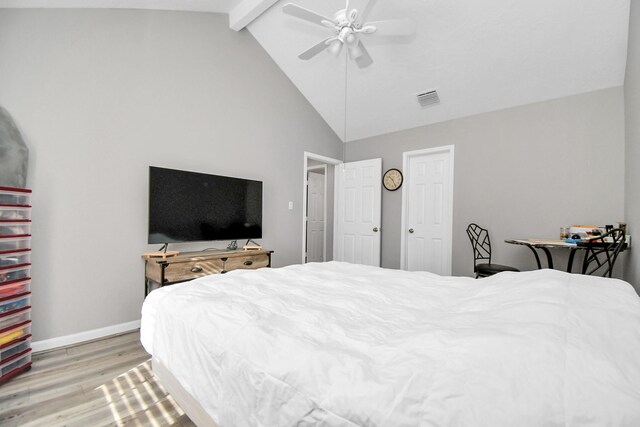 bedroom with beam ceiling, light hardwood / wood-style floors, high vaulted ceiling, and ceiling fan