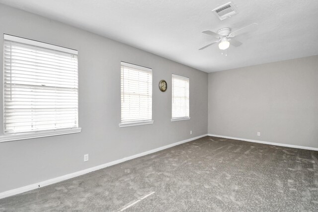 carpeted empty room with ceiling fan