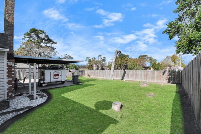 view of yard with a carport