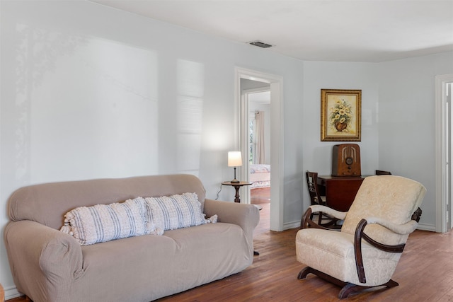 living room with hardwood / wood-style flooring and a wealth of natural light