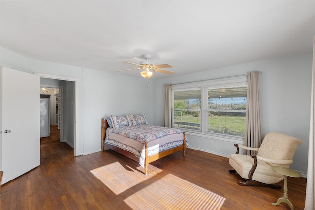 bedroom featuring ceiling fan and dark hardwood / wood-style floors