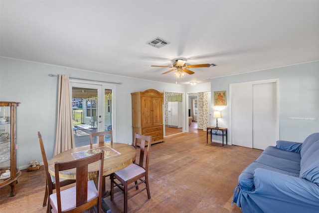 dining space featuring ceiling fan and hardwood / wood-style floors