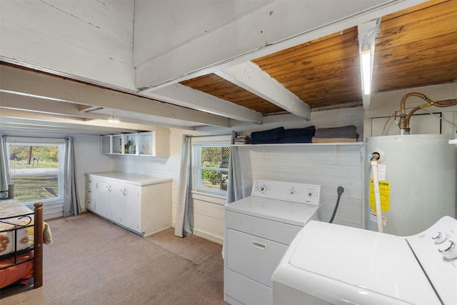 laundry area with washing machine and clothes dryer, light colored carpet, wood ceiling, and water heater