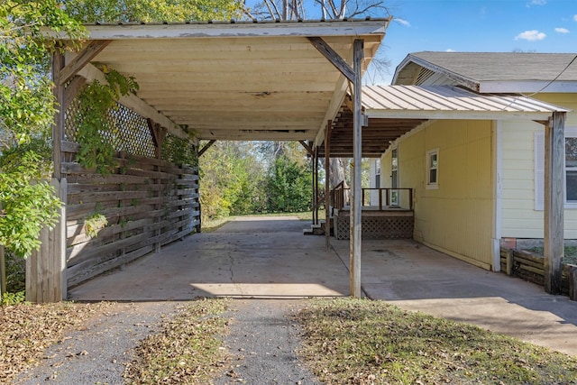 view of vehicle parking with a carport