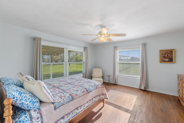 bedroom featuring ceiling fan and hardwood / wood-style flooring