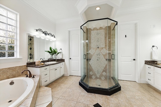 bathroom with tile patterned flooring, vanity, and a wealth of natural light