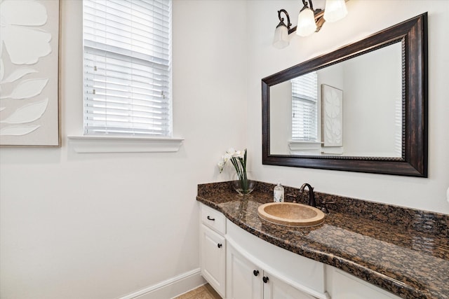 bathroom with vanity and a wealth of natural light