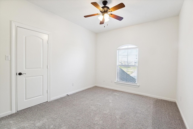 spare room with ceiling fan and carpet floors