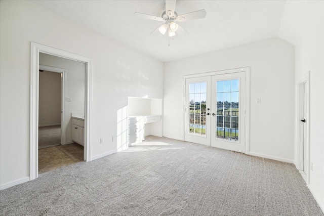 unfurnished bedroom with lofted ceiling, light carpet, access to outside, french doors, and ceiling fan