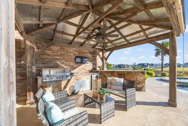 view of patio with a gazebo, area for grilling, and ceiling fan