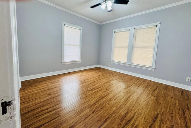 spare room with hardwood / wood-style floors, ceiling fan, and ornamental molding