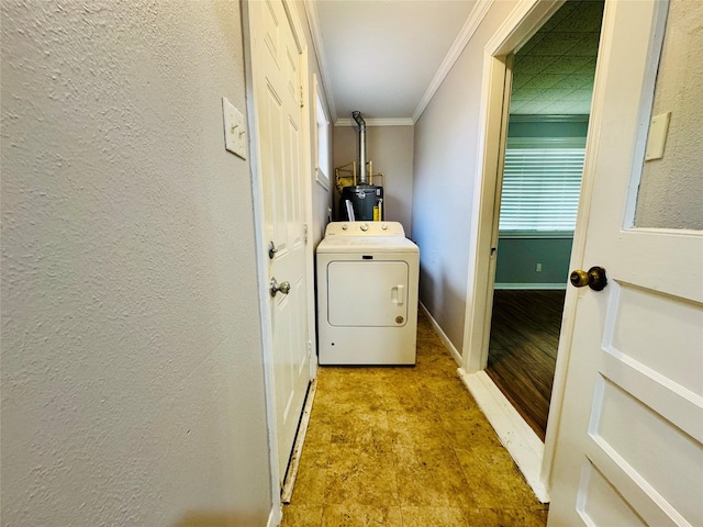 clothes washing area with light hardwood / wood-style flooring, washer / dryer, crown molding, and water heater