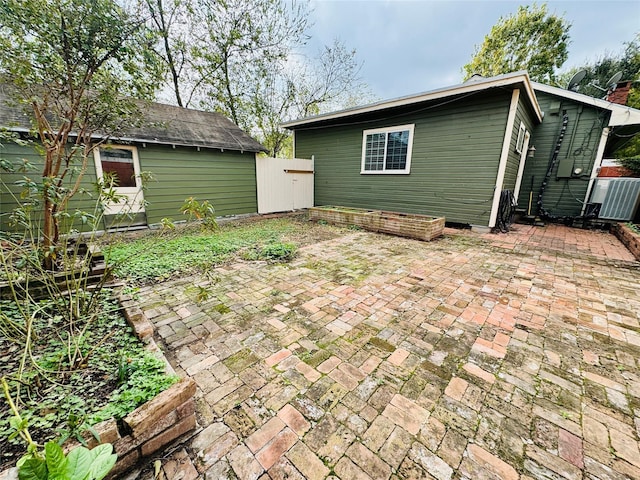 exterior space featuring a patio area and a storage shed