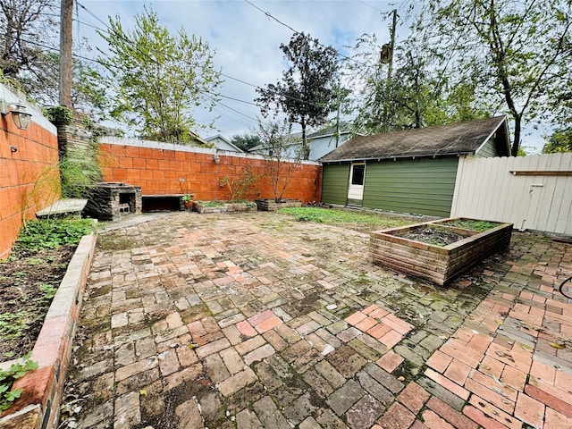 view of patio with a shed