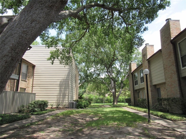 view of yard featuring central air condition unit